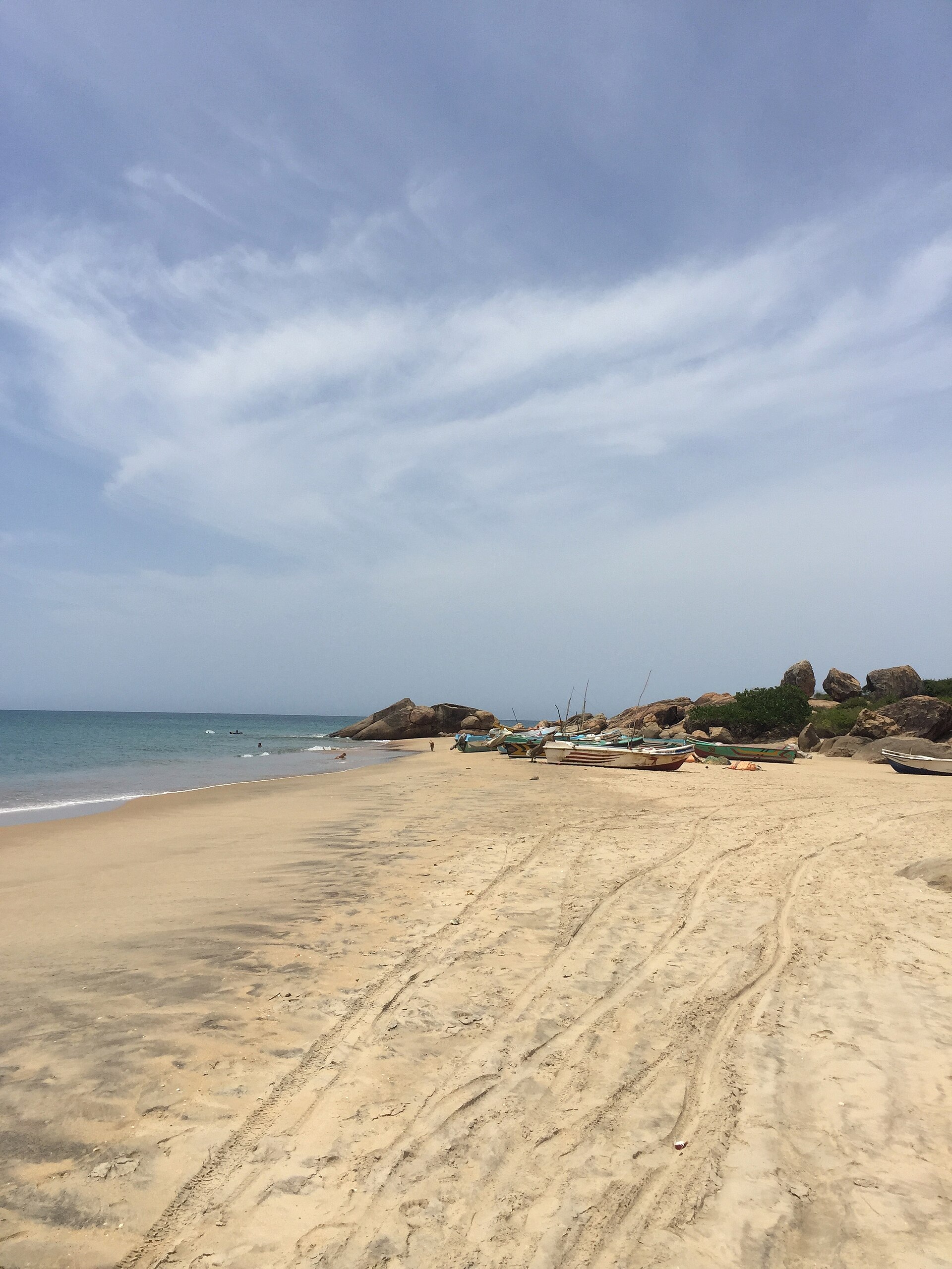 A surf break at Whiskey Point on Sri Lanka's east coast, with waves peeling along the headland.
